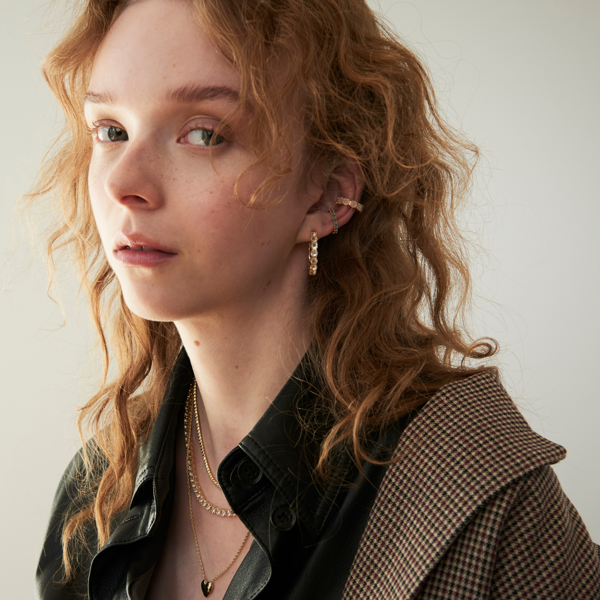 model wearing the 25mm crystal quartz hoop earrings and matching ear cuff