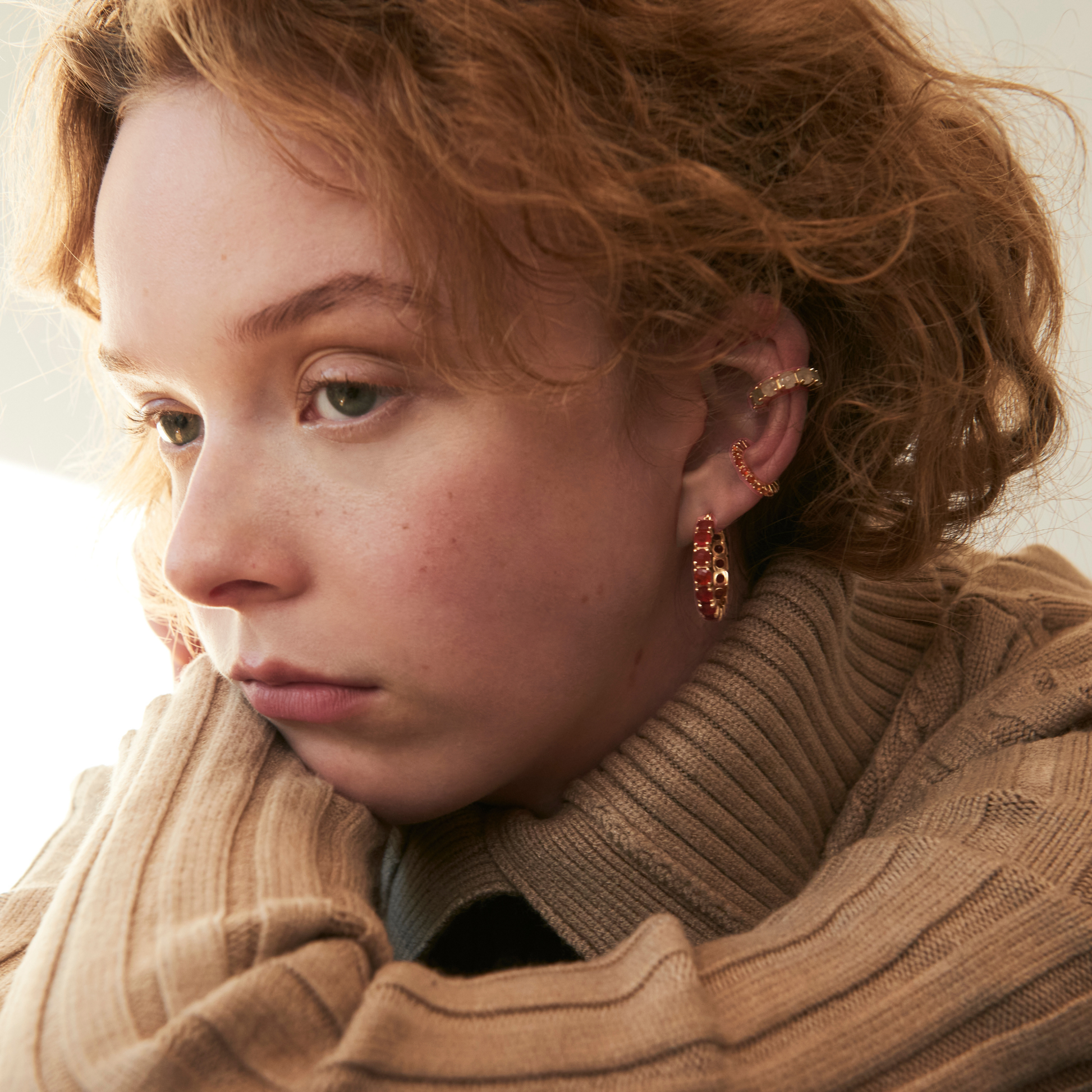 model wearing carnelian earrings and the 4mm aventurine ear cuff