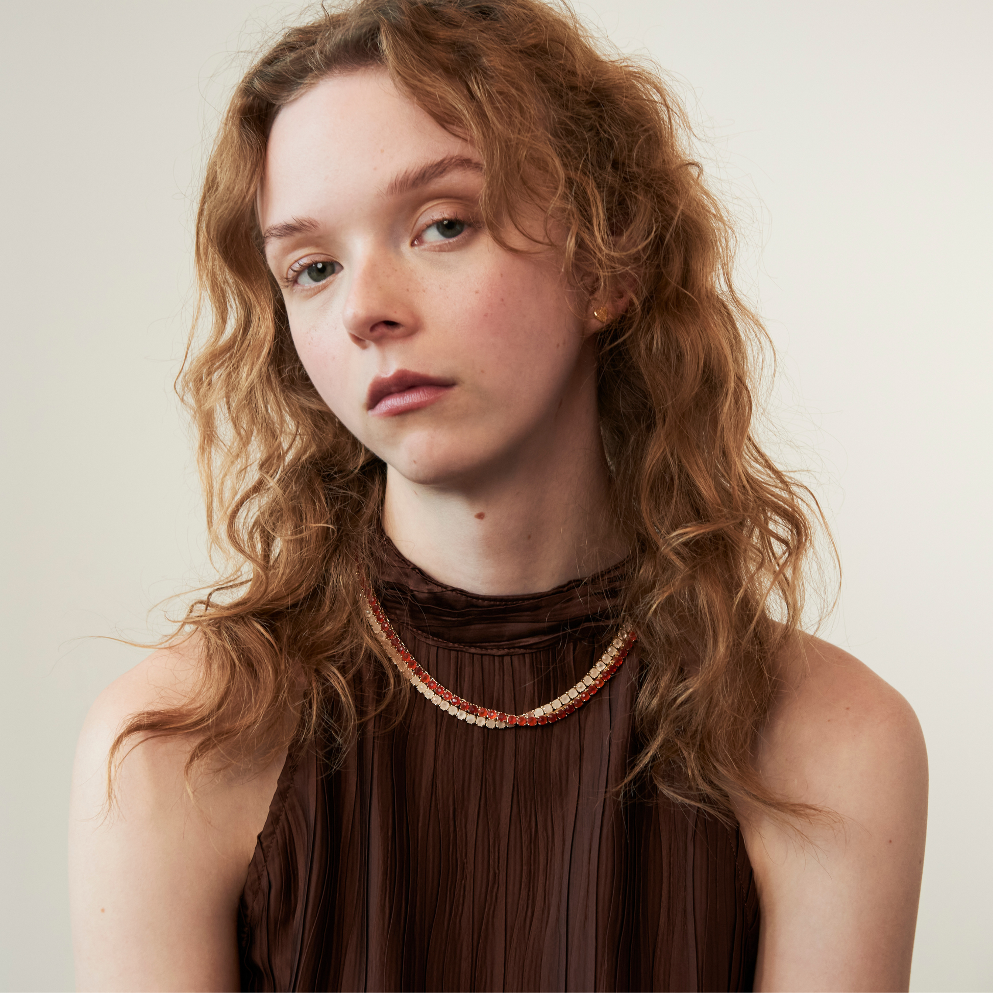 model wearing the 4mm carnelian tennis necklace and 4mm rose quartz tennis necklace 