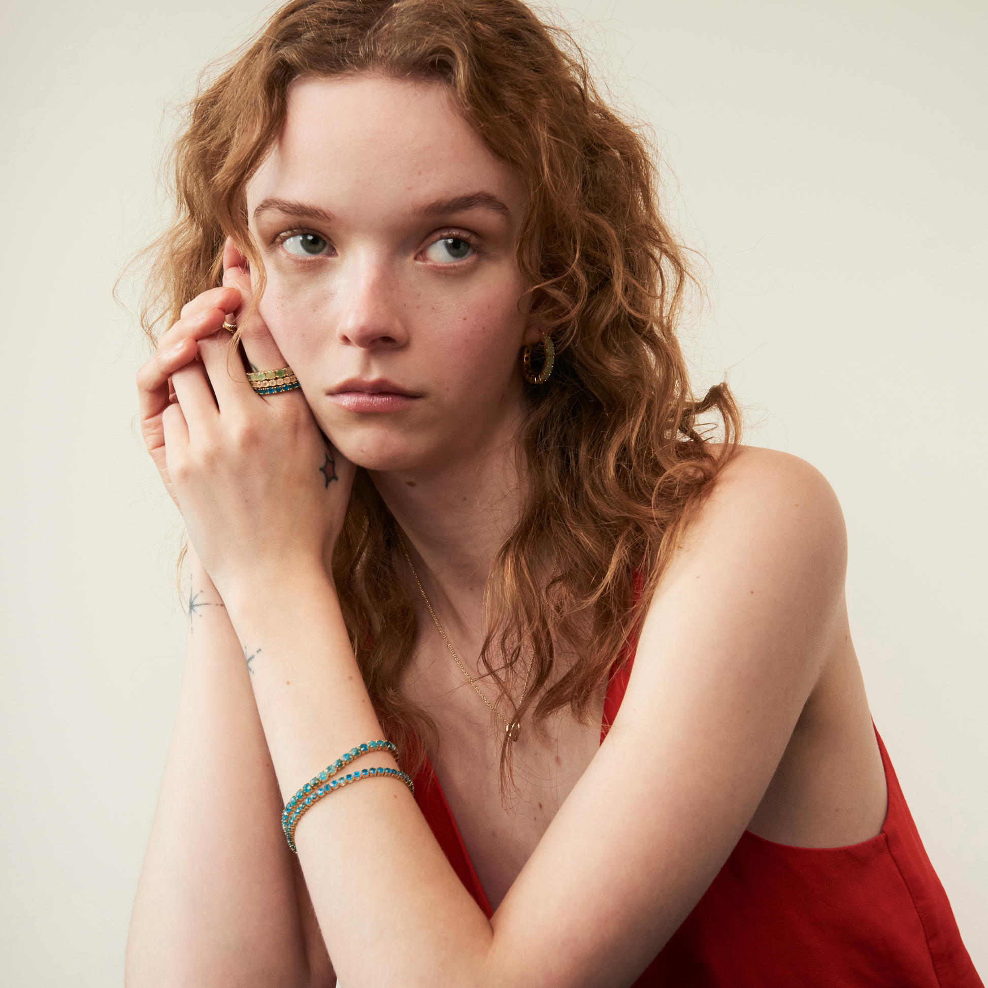 model wearing eternity band rings and tennis bracelets including the 3mm apatite tennis bracelet