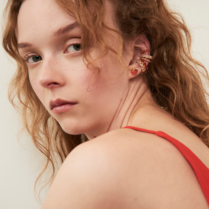 model wearing a beautiful ear stack including the 4mm carnelian ear cuff and carnelian heart stud earrings
