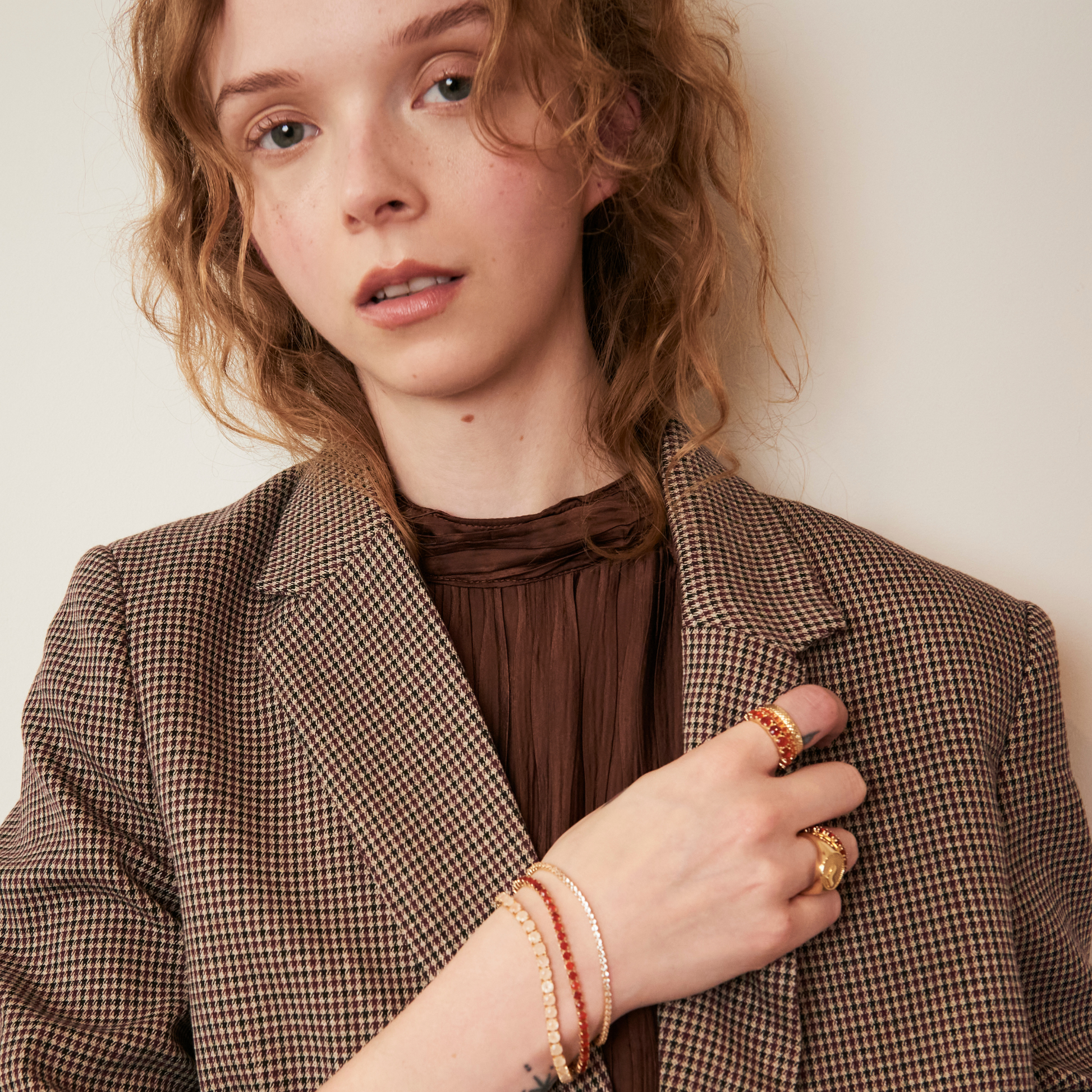 model wearing statement pieces including the 4mm carnelian eternity band ring 