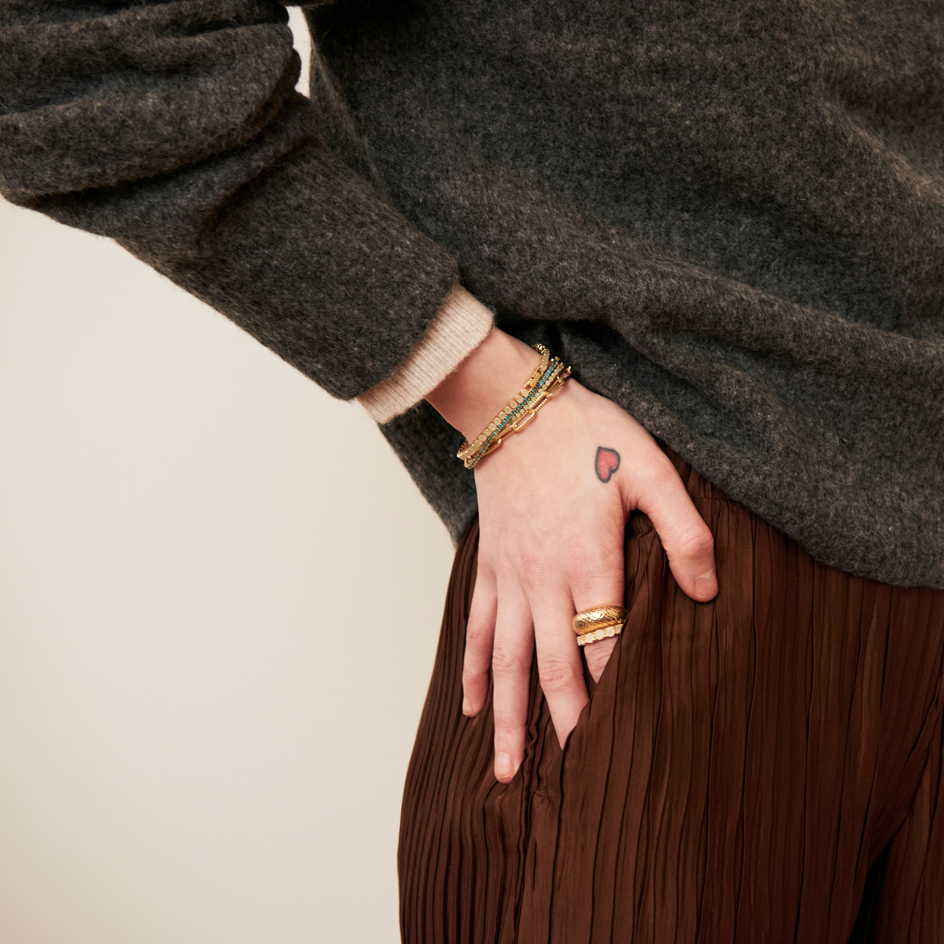 model wearing gold bracelets including the 3mm aventurine tennis bracelet 