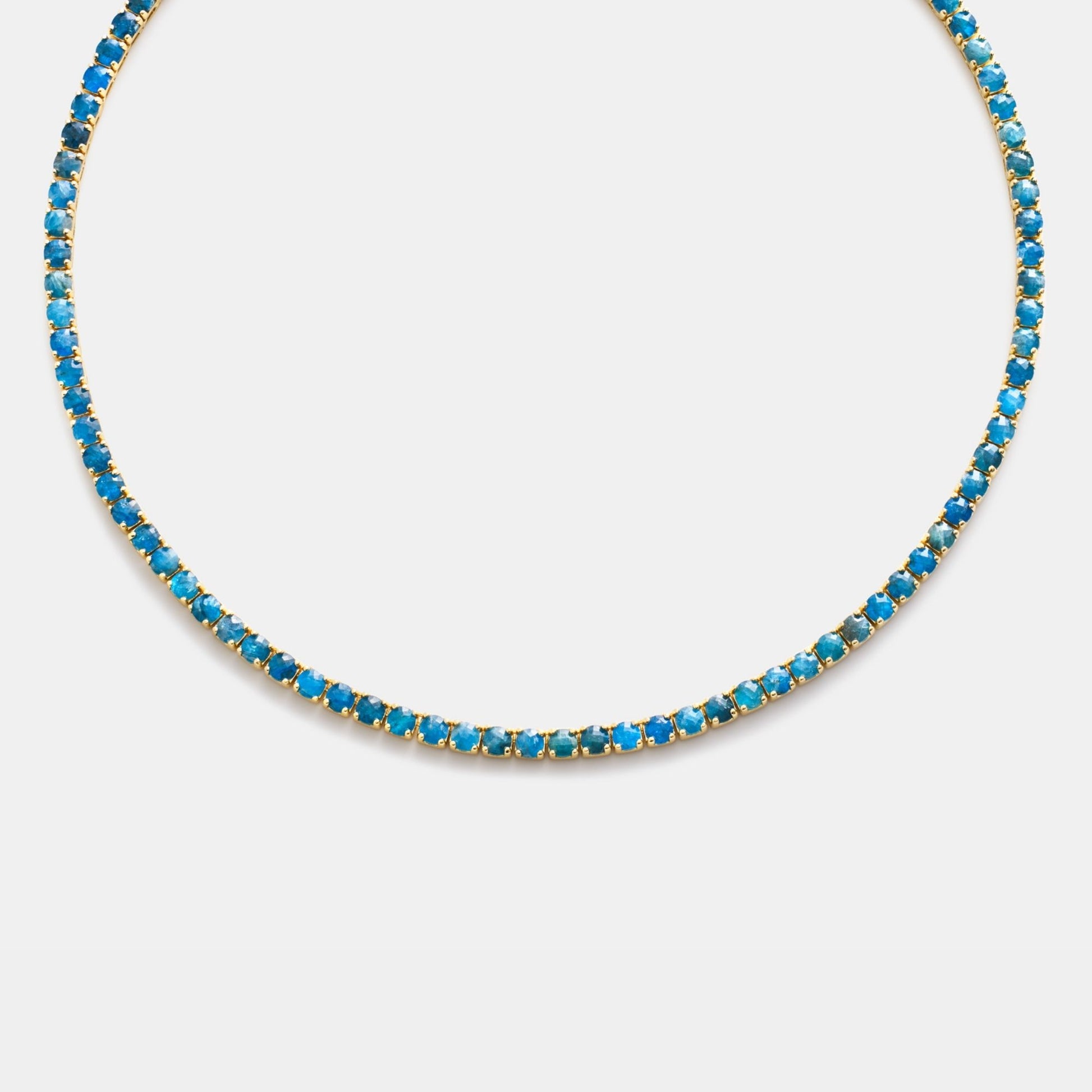 Necklace with blue beads on a white background