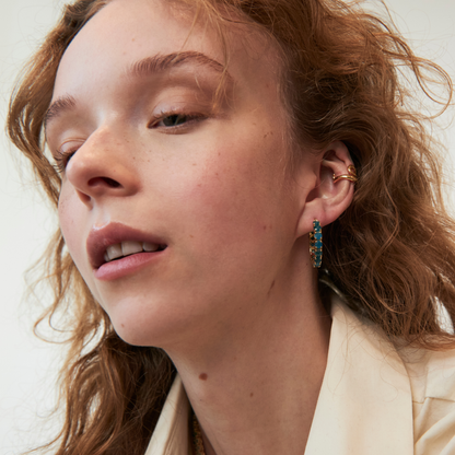 model wearing the 25mm apatite hoop earrings and the abstract heart ear cuff