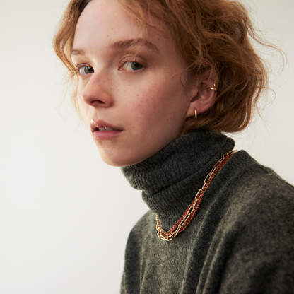 model wearing abstract heart ear cuff