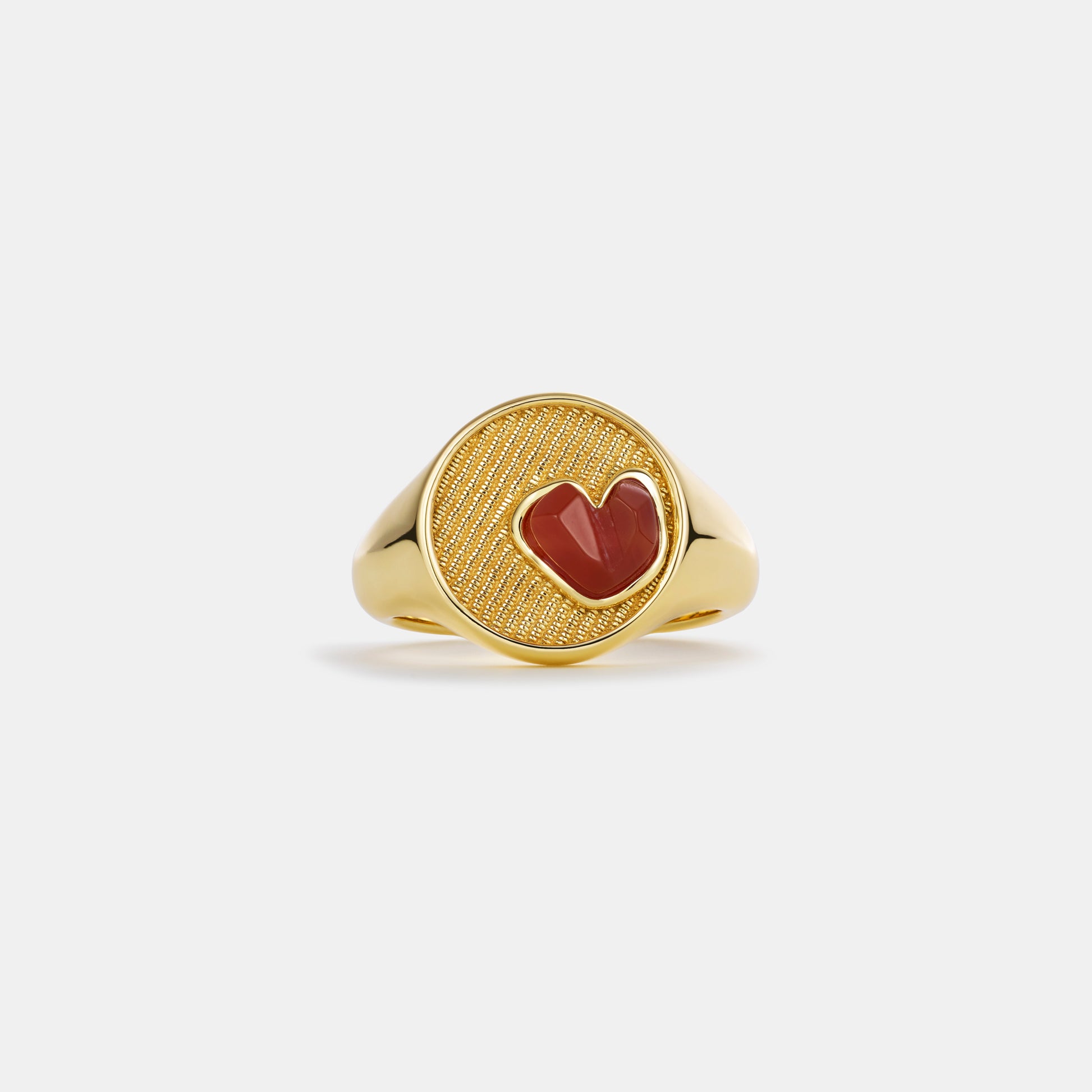 carnelian heart signet ring on white background