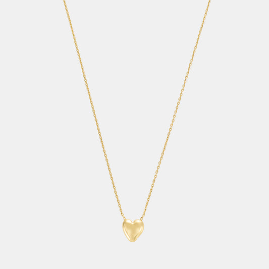 sculpted heart pendant necklace on white background
