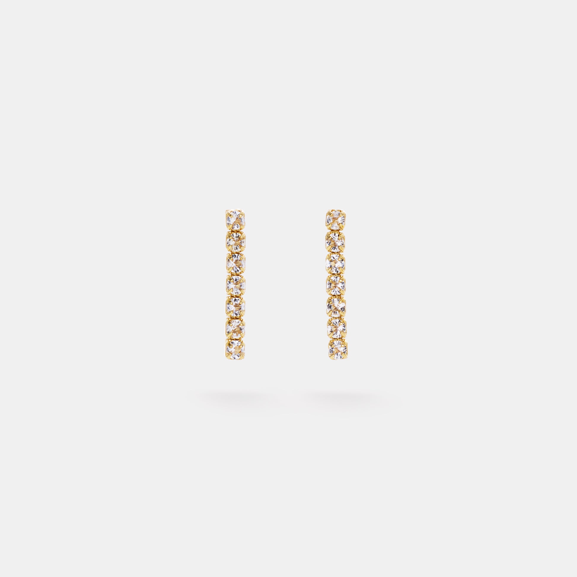 crystal quartz mini tennis earrings on white background