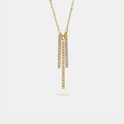 Gold necklace with pendant on a white background