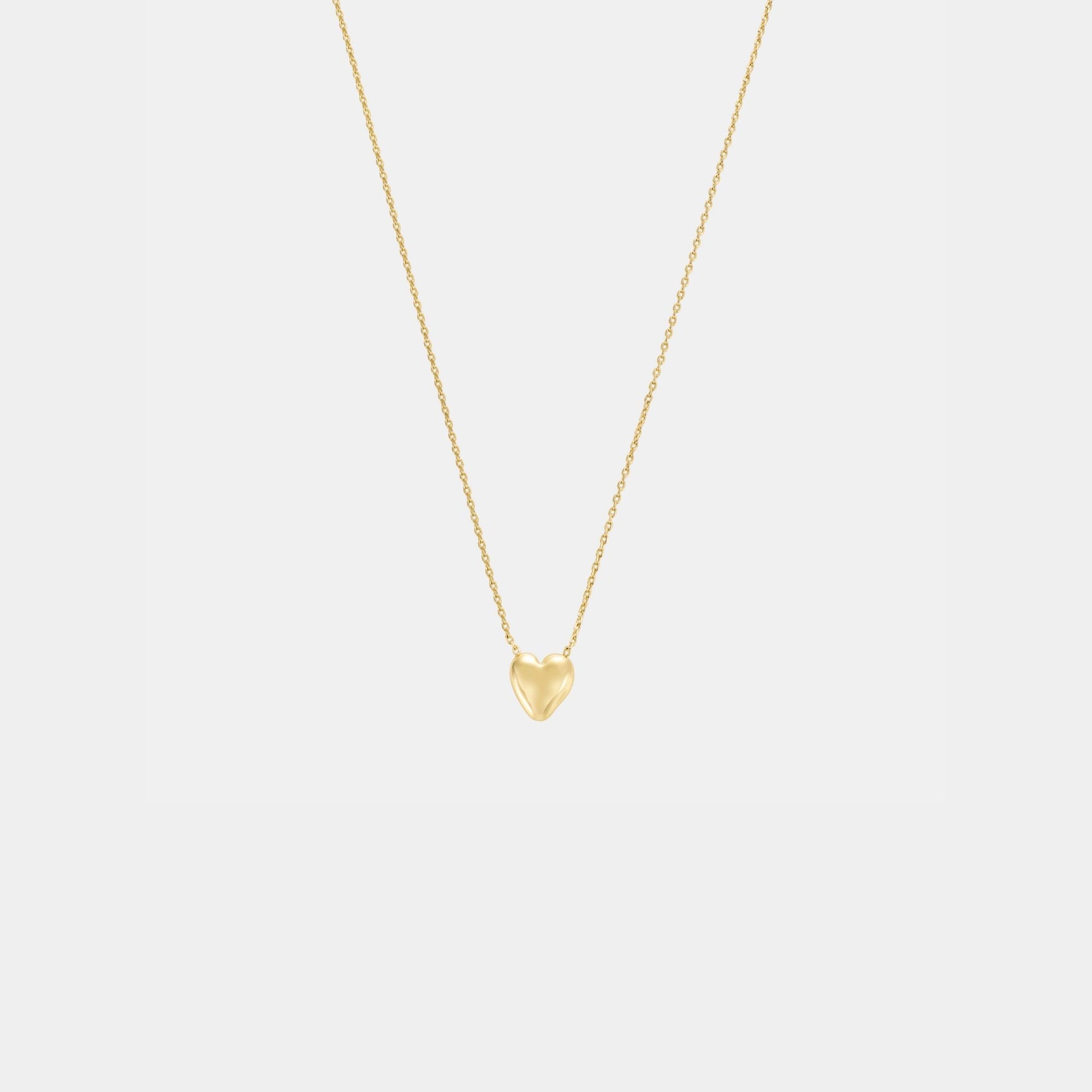 Gold heart-shaped pendant necklace on a light gray background