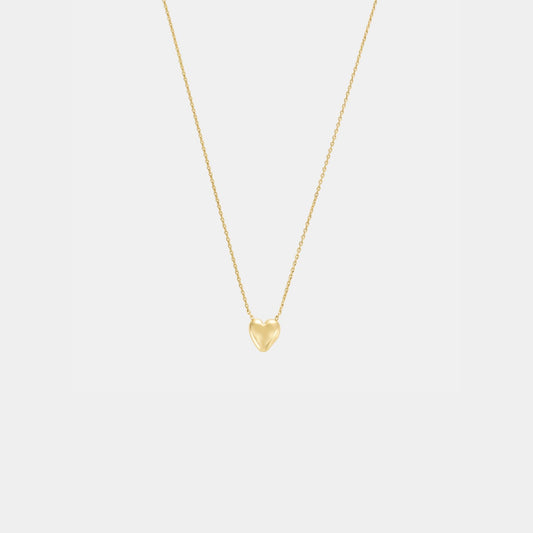 Gold heart-shaped pendant necklace on a light gray background